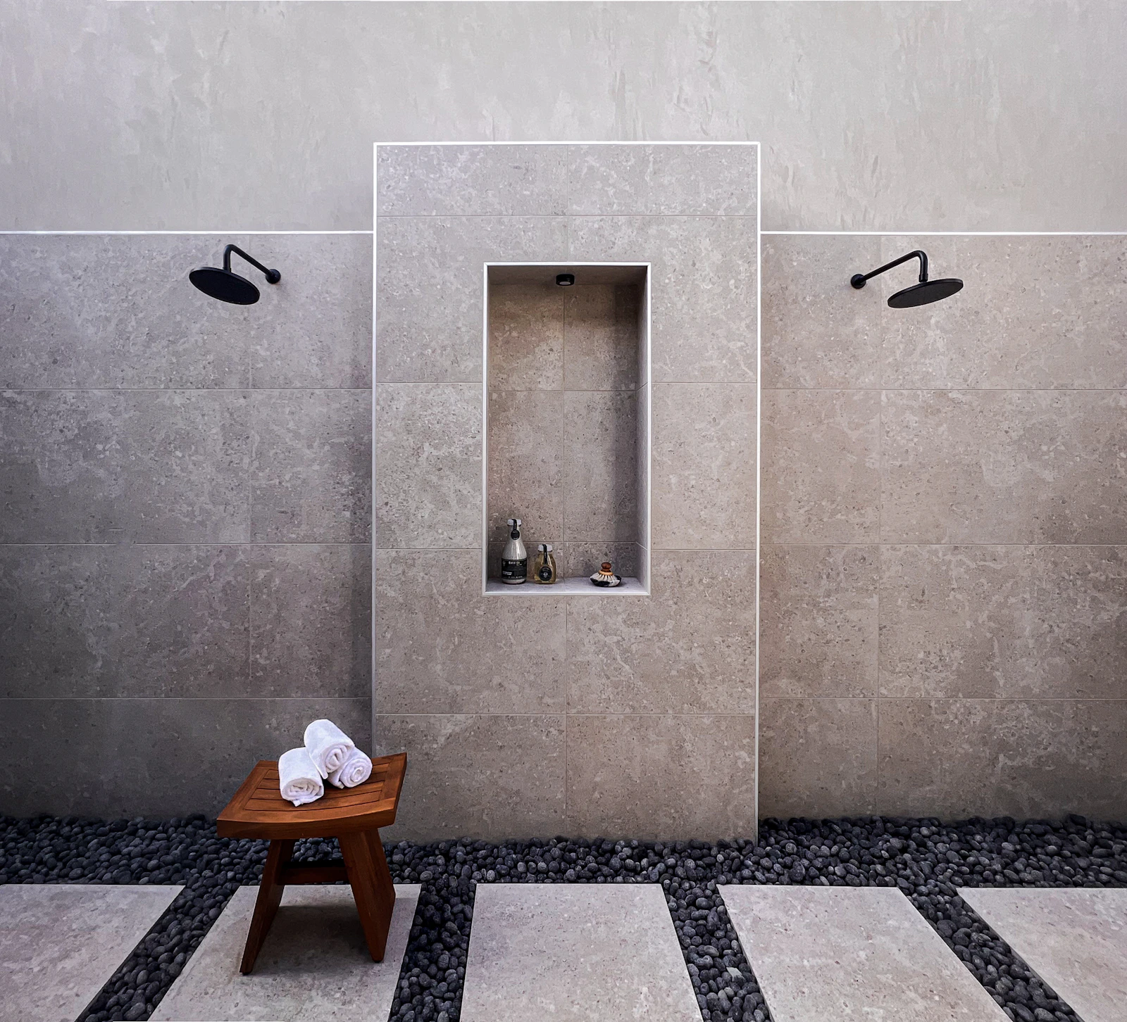 marble bathroom freestanding bath warm stone tiles brass fixtures luxury