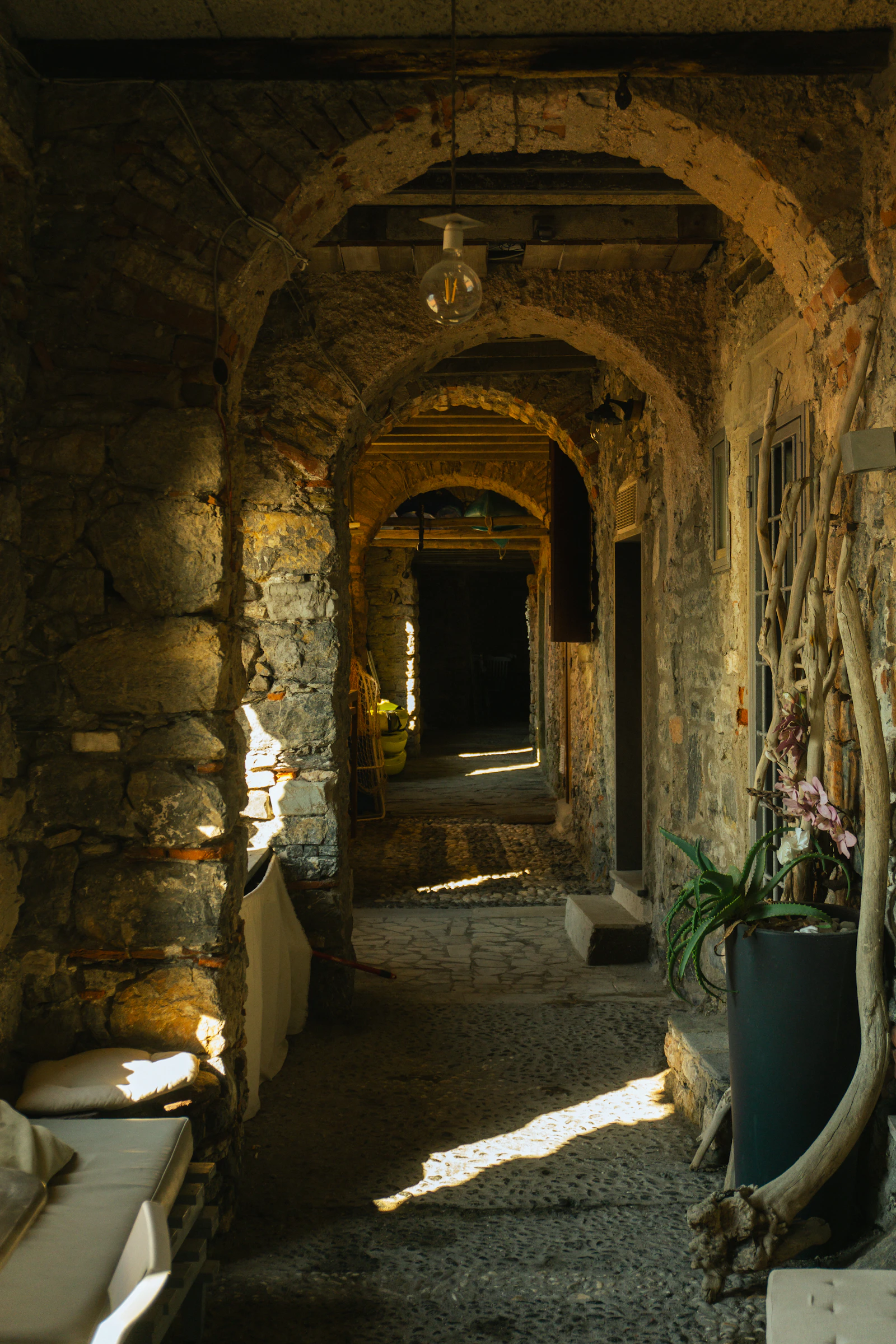 elegant tuscan villa interior with stone walls and modern classic furnishings