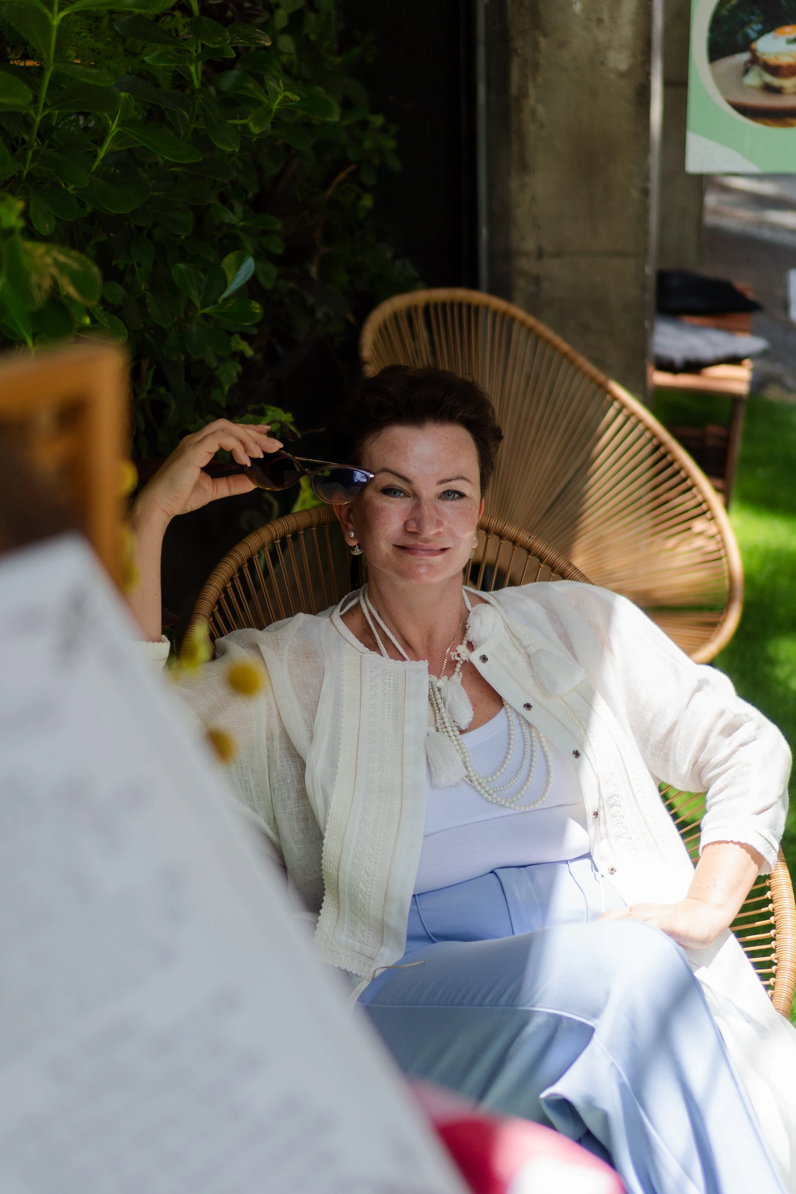 Life coach Elena Voss in a peaceful garden setting