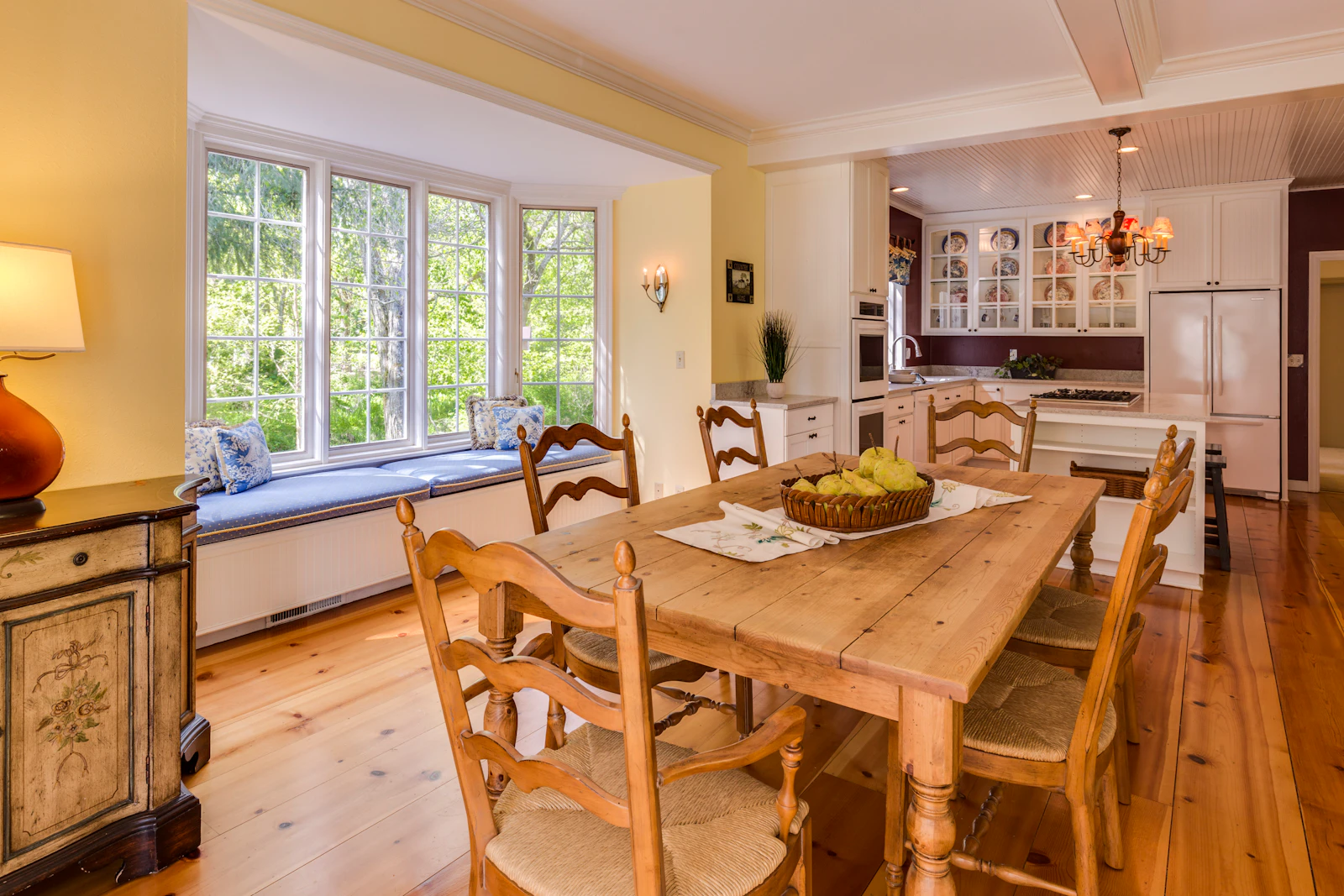 Rustic wide-plank oak floor in an open-plan farmhouse kitchen