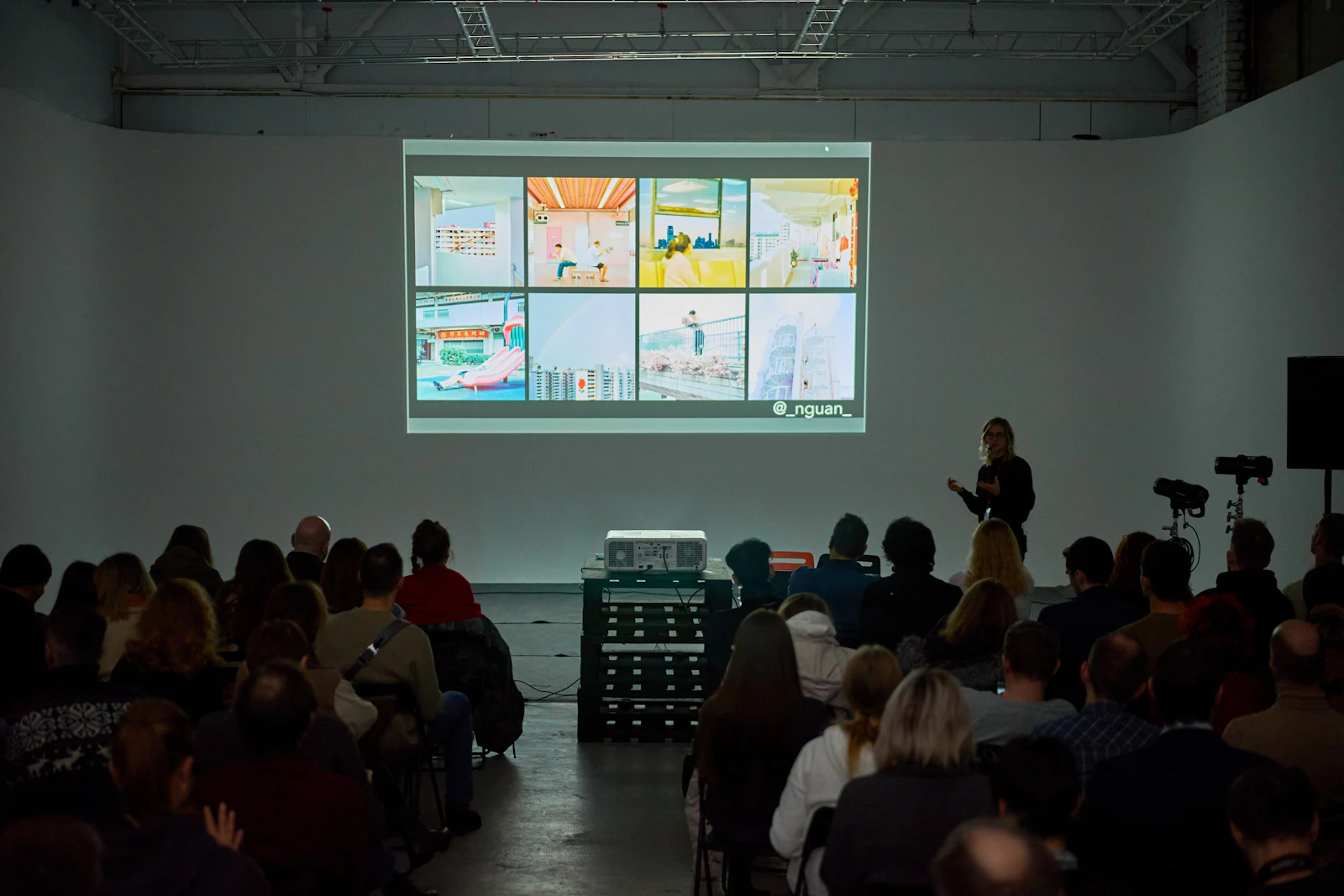 designer presenting UI mockups on big screen presentation