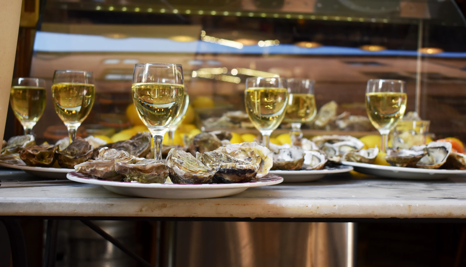 champagne and oysters on silver tray luxury restaurant